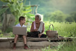 boy_laptop_grandma_outside_access_technology-scaled