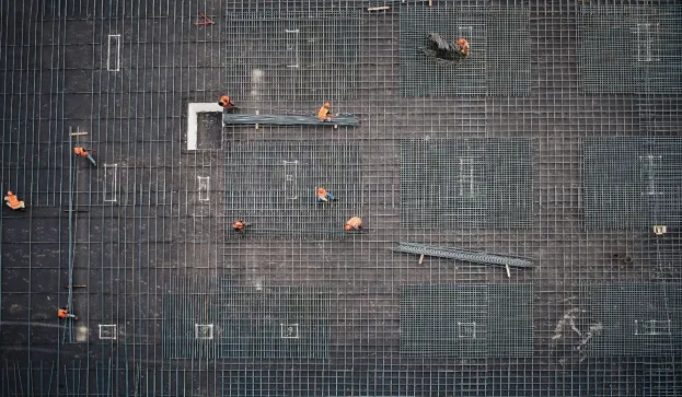 workers-building-metal-installation-on-building-just-transition